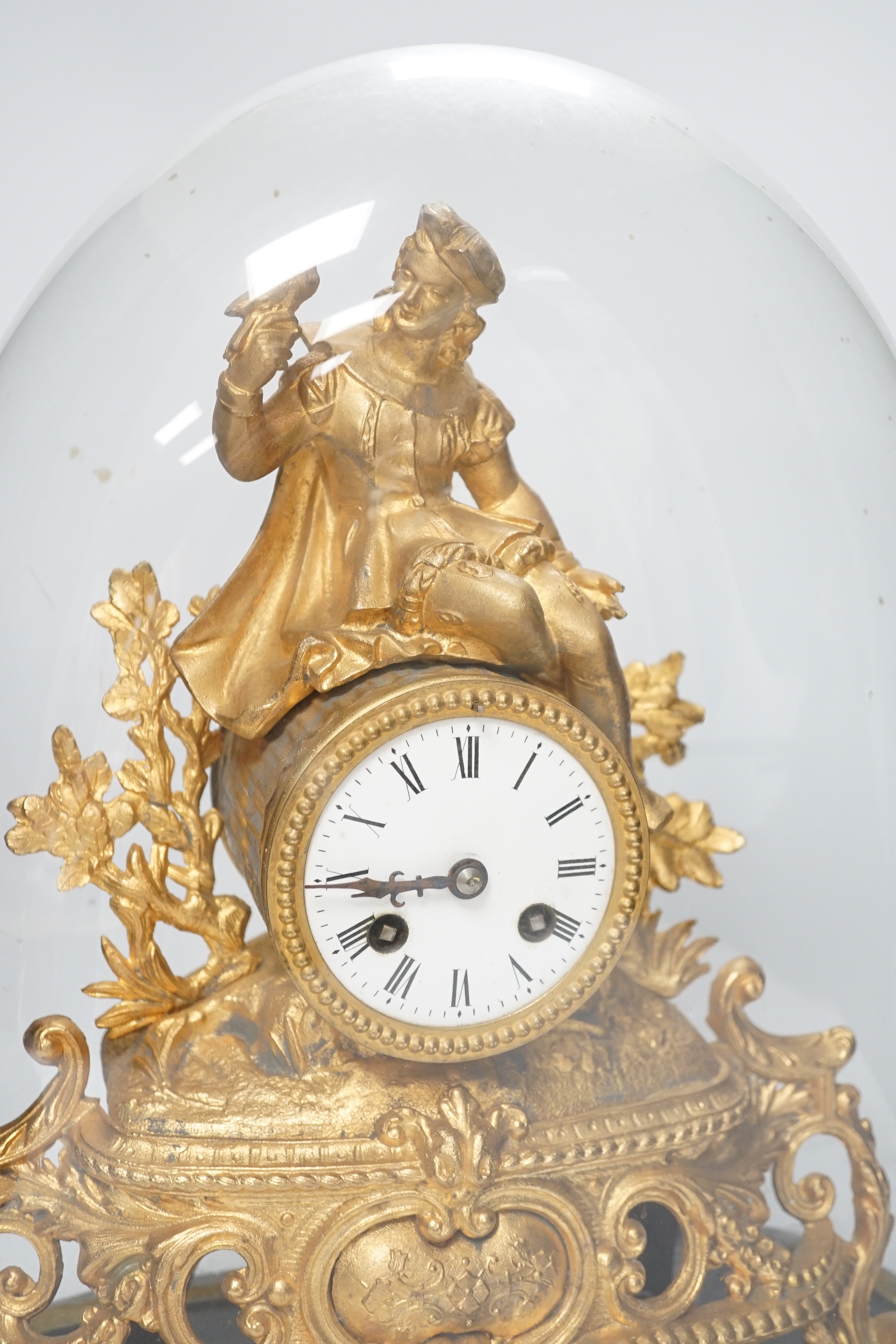 A 19th century Louis XVI-style gilt metal mantel clock, under glass dome, French movement striking on a bell, with key, 41cm